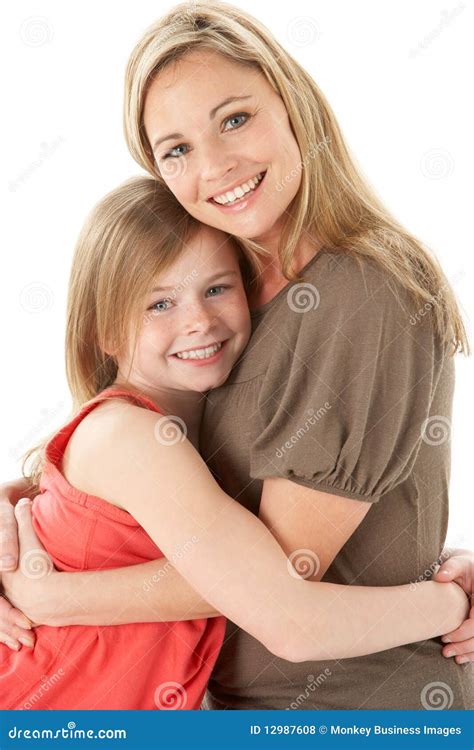 Studio Portrait Of Mother Hugging Young Daughter Stock Photo Image Of