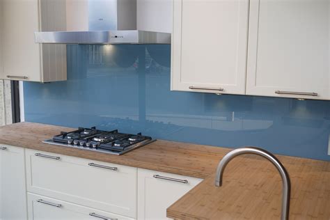 Our pimped kitchens section shows you our splashback designs in a. Pale blue glass splashback set against a natural block ...