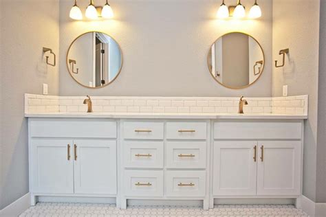 Learn how to design your perfect bathroom with help from delta faucet. Master bath with beveled white subway tile backsplash ...