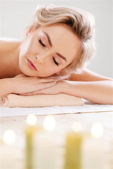 Young Beautiful And Healthy Girl Relaxing In Spa Salon Rejuvenation Therapy And Massaging