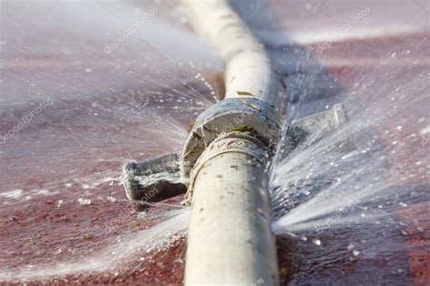Wasting Water Water Leaking From Hole In A Hose — Stock Photo © Toa55