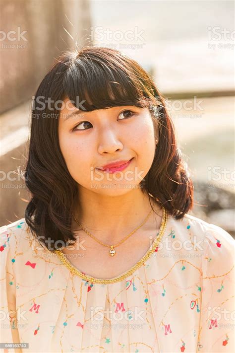 Portrait Of An Attractive Young Japanese Woman Stock Photo Download