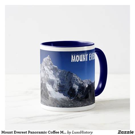 A Blue And White Mug Sitting On Top Of A Marble Counter Next To A Mountain