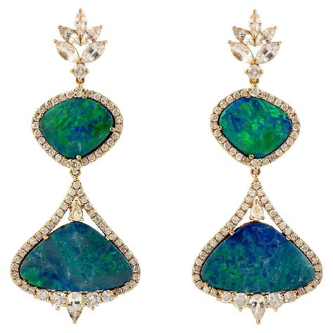 Drop Shape Blue Sapphire Dangle Earring With Diamonds Made In 18k Gold