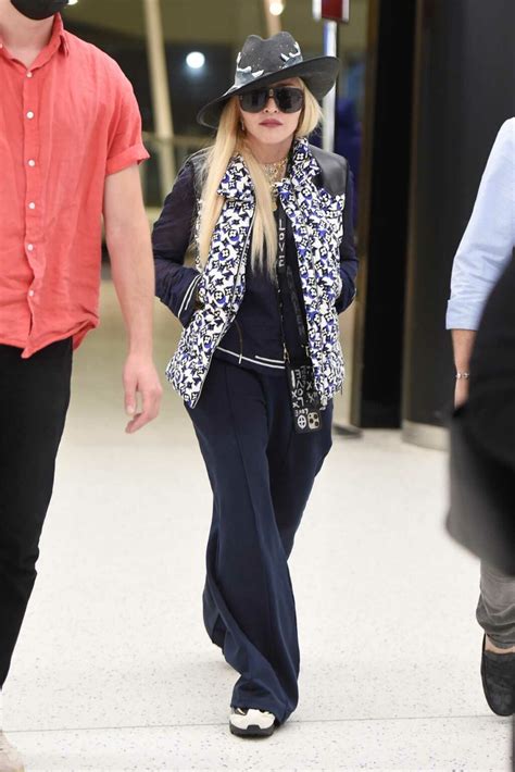 Madonna In A Black Quirky Fish Hat Arrives At Jfk Airport In New York