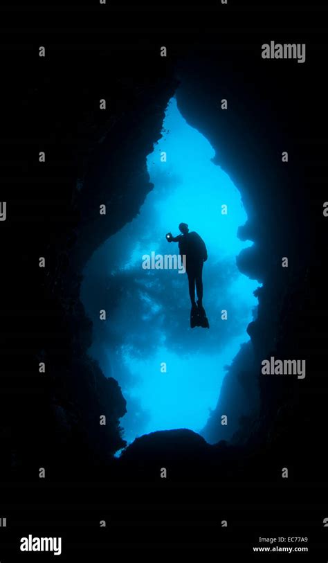 Scuba Diver Entering Underwater Cave Stock Photo Alamy