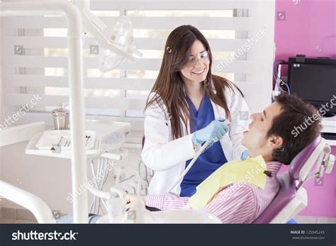 Happy Latin Dentist Bringing Clean Smile Stock Photo (Edit Now) 125945243