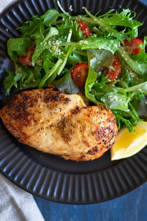 Then add the chicken to the basket or tray, coat the olive oil over the chicken, and season with garlic powder, salt, and pepper. Air fryer Frozen Chicken Breast Recipe - Enjoy Clean Eating