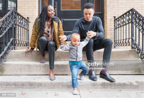 Child Sitting On Stoop Photos And Premium High Res Pictures Getty Images