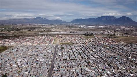 Township In Cape Town With Table Mountain Landmark Seen From Drone