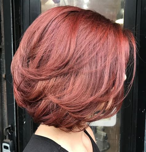 An asymmetrical bob haircut gives an edgy vibe to the standard look, which you can further customize with curls and colors. 20 Ideas of Bob Haircuts with Symmetrical Swoopy Layers
