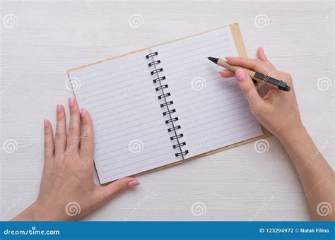 Notepad And Pen In Hands Stock Photo Image Of List 123294972