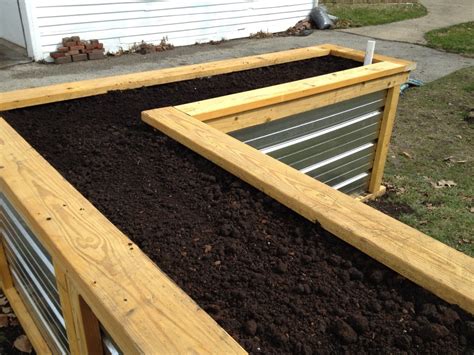 Its easy, its cheap and works. Building a Self Watering Raised Garden Bed - Frugal Living