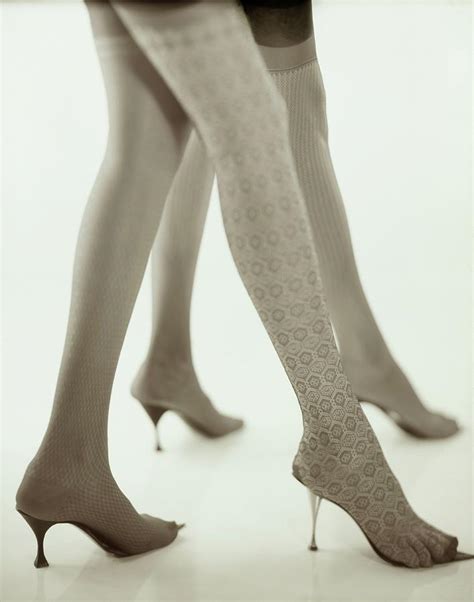 Models Wearing Textured Stockings And Heels Photograph By Karen Radkai