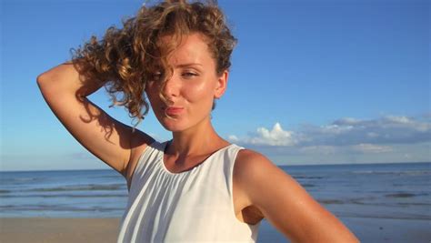 beautiful girl curly hair flirting beach stock footage video 100 royalty free 12534404