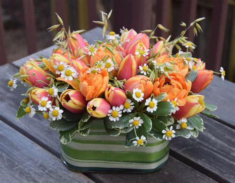 Spring Flower Arrangement With Tulips And Camomile Flowers Tulips