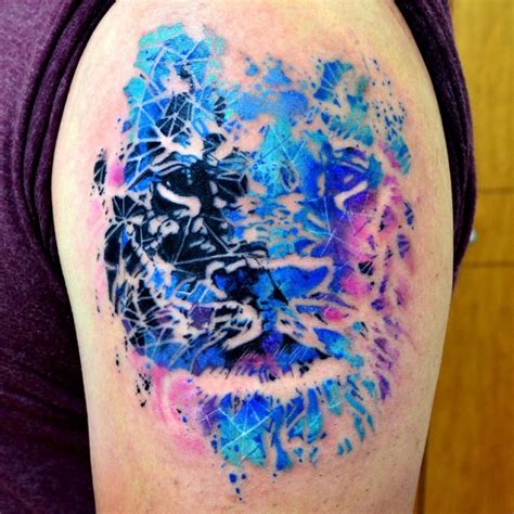 Abstract Style Colored Shoulder Tattoo Of Lion Face Tattooimagesbiz