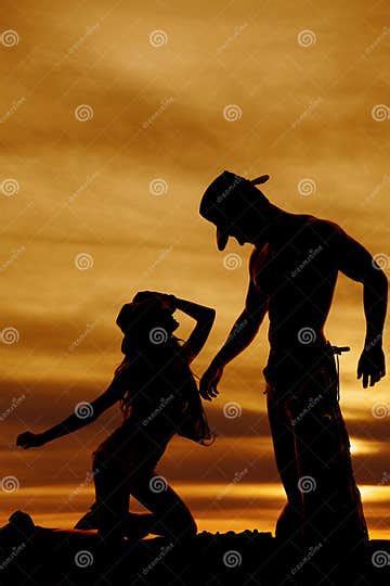 Silhouette Cowgirl Kneel Look Up At Cowboy Stock Photo Image Of