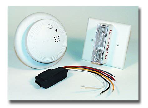 Electric smoke detectors with battery backup. USI Electric USI-2413 Smoke Alarm and Strobe Light Kit ...