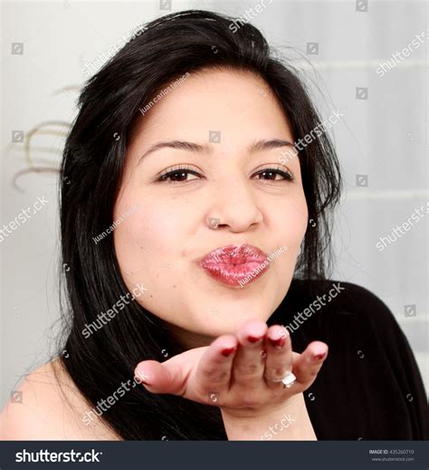 Portrait Beautiful Woman Blowing Kiss Home Stock Photo