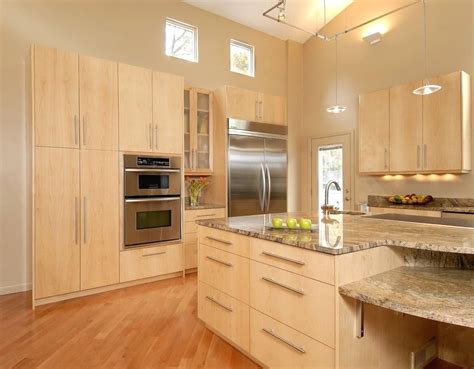 Remind whenever you are using maple always symphonize make sure to use white which brings the best contrast indeed. light stained kitchen cabinets with wood floors - Google ...