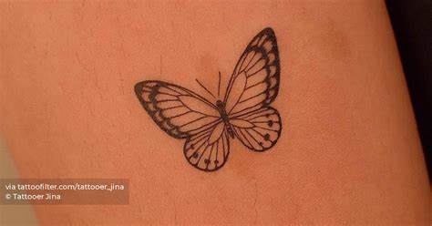 Fine Line Butterfly Tattoo On The Upper Arm