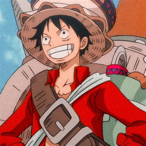 An Anime Character Wearing A Red Shirt And Hat
