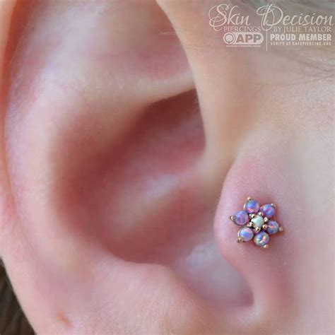 This New Tragus Piercing By Juliethepiercer Is Holding The Cutest Rose