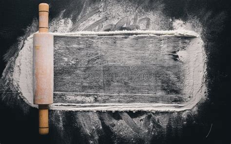 Rolling Pin And White Flour On A Dark Background Stock Photo Image