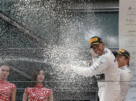 F1 Lewis Hamilton Sprays Champagne On Podium Girl