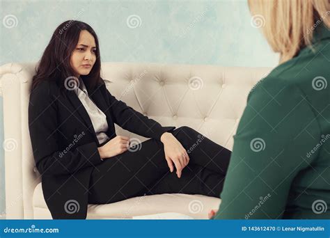 Woman Having Consultation With Female Psychologist Stock Photo Image