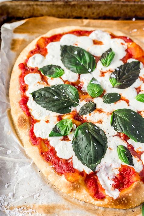 This easy margherita pizza recipe, inspired by italian cooking, is perfect for beginners as it's simple to try and teaches you how to make pizza dough. Easy Classic Margherita Pizza Recipe | Sugar & Soul