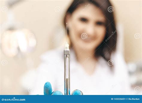 Closeup Photo Of Female Dentist In The Dental Room Holding Oral Syringe Stock Image Image Of