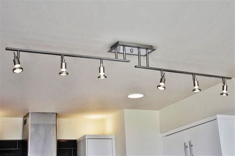 Apart from offering ample illumination, they seem to bring along with them beautiful with an amazing array of pendant light designs now on offer, the lighting above your kitchen island need not look dull and boring anymore. kitchen-track-lighting-lowes - Welcome to Trinity Custom Homes