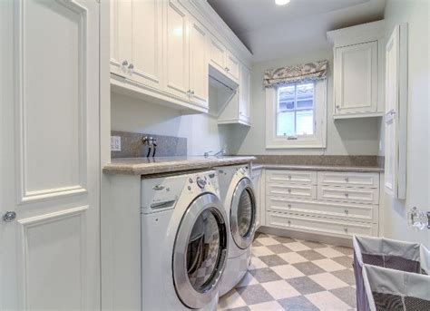Traditional white laundry room. Traditional white laundry room cabinet. Traditional white