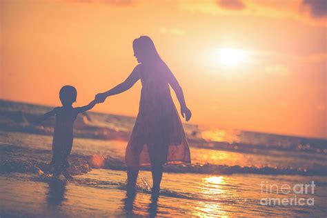 Mother With Her Daughter On The Beach Photograph By Sasin Tipchai Fine Art America