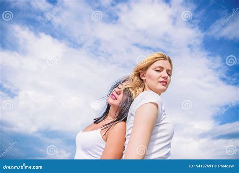 Young Beauty Girls On Cloudy Sky Adorable Women With Blond And