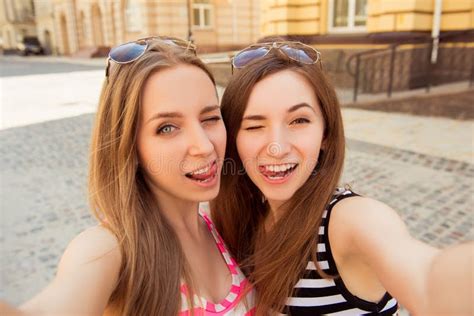 Two Beautiful Girl Making Selfie Photo And Showing Tongue Stock Image Image Of Camera