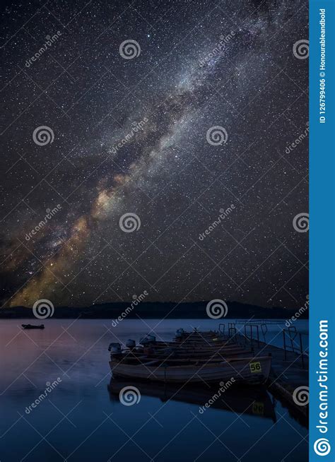 Vibrant Milky Way Composite Image Over Landscape Of Still Lake W Stock