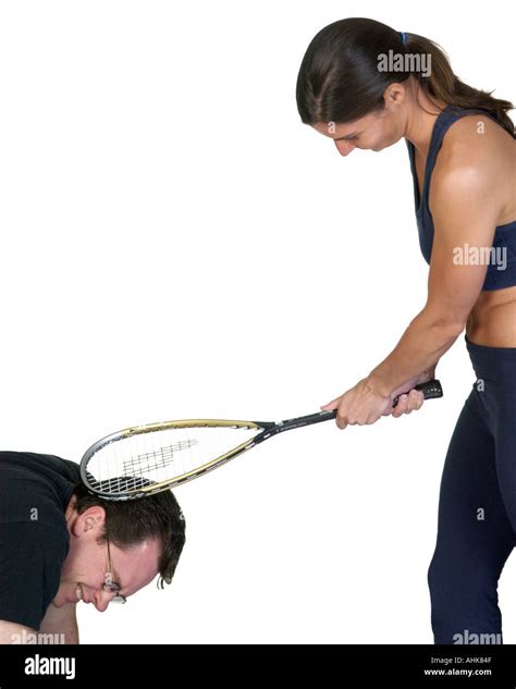 Woman Hitting Man S Head With A Racquetball Racket Stock Photo Alamy