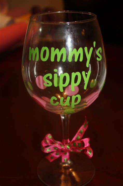 A Wine Glass With The Words Mommys Sippy Cup On It And A Bow