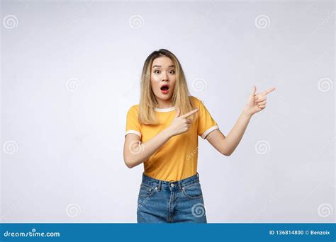 Smiling Woman Pointing Finger On Copy Space Isolated Portrait On White