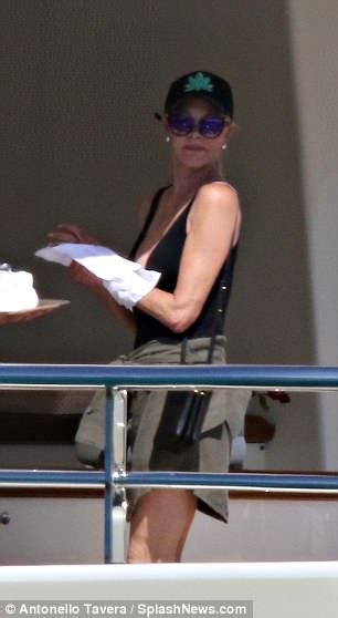 Melanie Griffith Puts On A Busty Display In Plunging Black Swimsuit