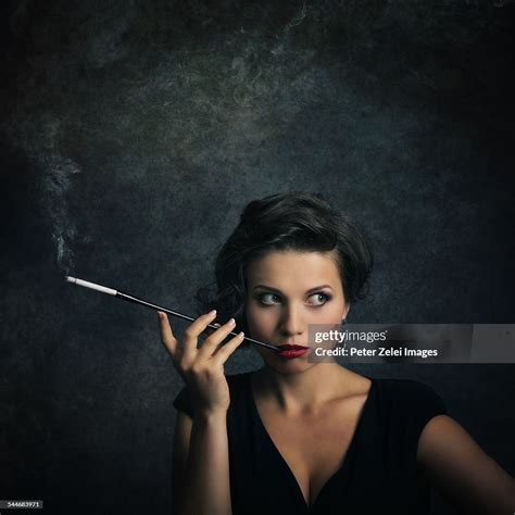 Woman With Cigarette Holder ストックフォト Getty Images