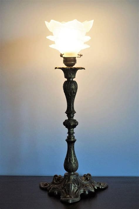 The add a color and style that is easy to describe and impossible to ignore. Bronze Candelabra Table Lamp with Glass Tulip Shade at 1stdibs