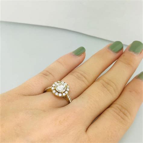 The effect is traditional with a modern twist, with a more unusual yet still elegant stone shape. 2 Carat Diamond Halo and Diamond Band Engagement Ring in ...