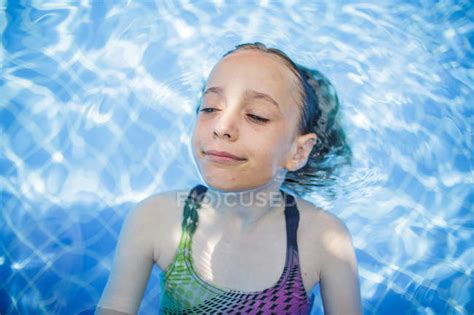 A Girl Is Having Fun In A Swimming Pool During Vacation — Adventure