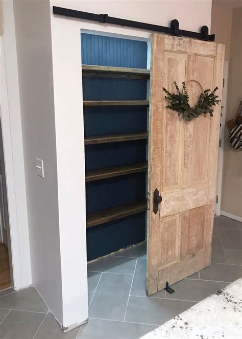 Before lining cabinet doors with extra shelves, make sure there's room inside for the doors to close. DIY pantry. Farmhouse rolling door. | Diy pantry