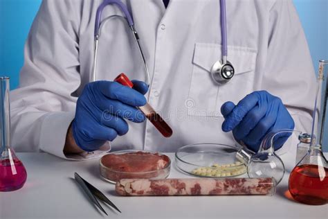 Photo Of Doctor With Blood Test Tube And Meat In Petri Dish Stock Image