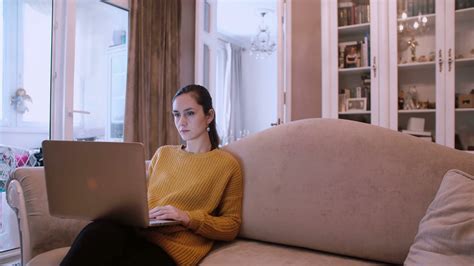 Beautiful Girl Sitting On Sofa Using Laptop Stock Footage Sbv 311883074 Storyblocks